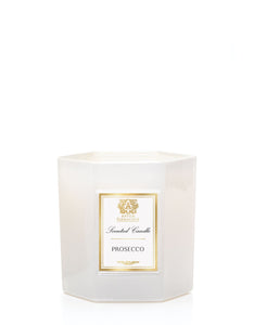 Hexagon soft white glass candle container with white gold Antica Farmcista label.
